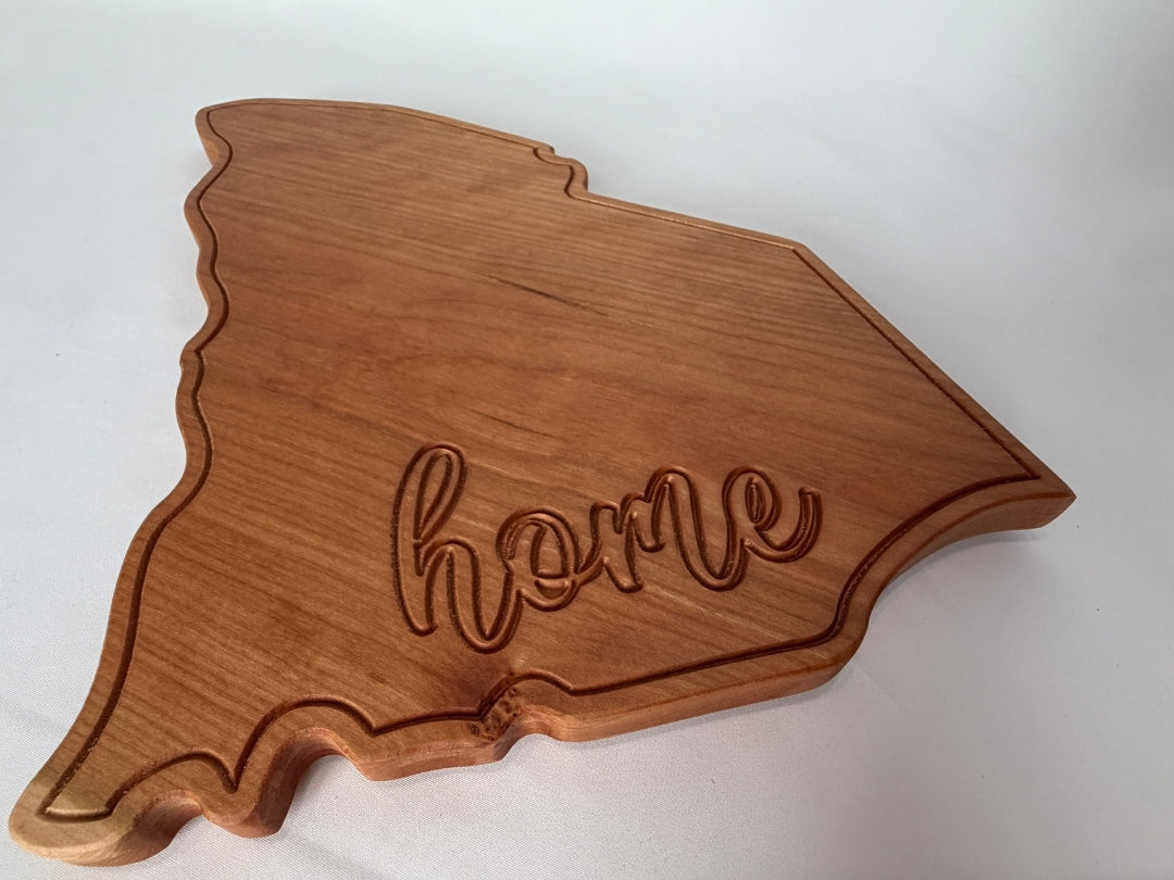 South Carolina shaped hardwood serving board with engraved home detail on white background
